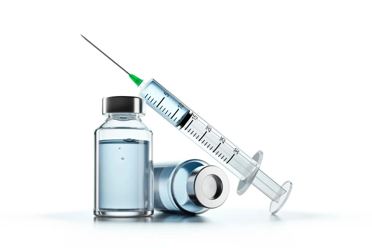 Vitamin injection vials and a syringe on a clean white surface in Eldon, MO